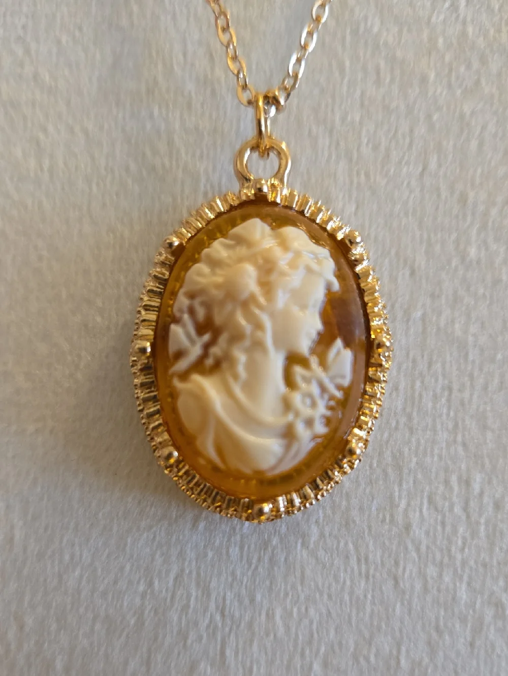 Gold Raised Cameo Pendant Necklace On Intricate Diamond Cut Chain Back in Stock.